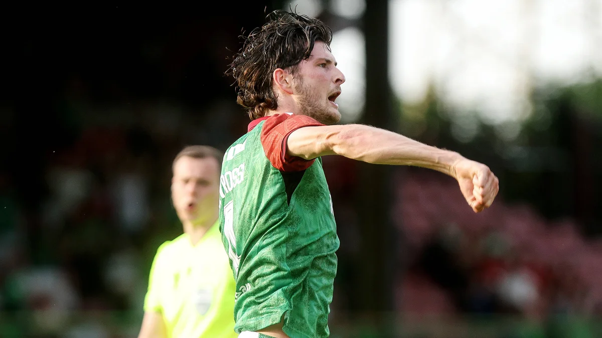 Glentoran's Zeno Rossi celebrates scoring the opening goal against RFS in a UEFA Europa Conference League match.