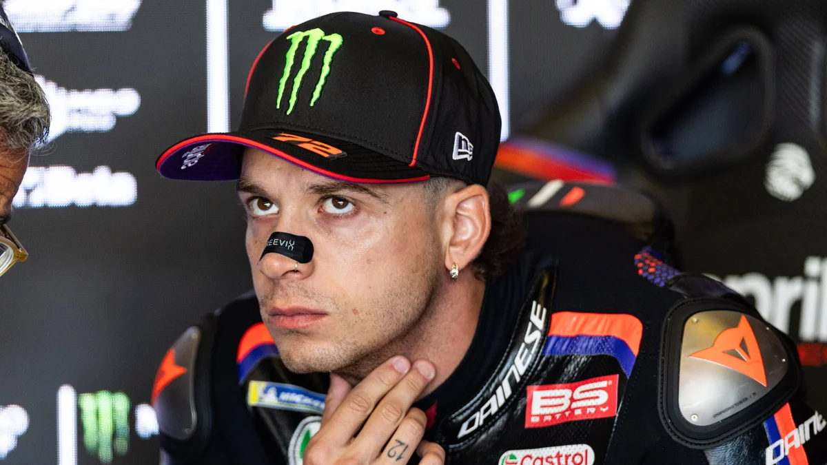 MotoGP rider Marco Bezzecchi slides off his Aprilia motorcycle during a crash at the German Grand Prix.