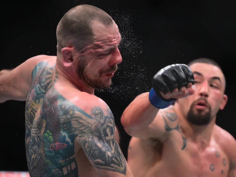 Robert Whittaker Secures Knockout Victory in Light Heavyweight Debut at UFC 329