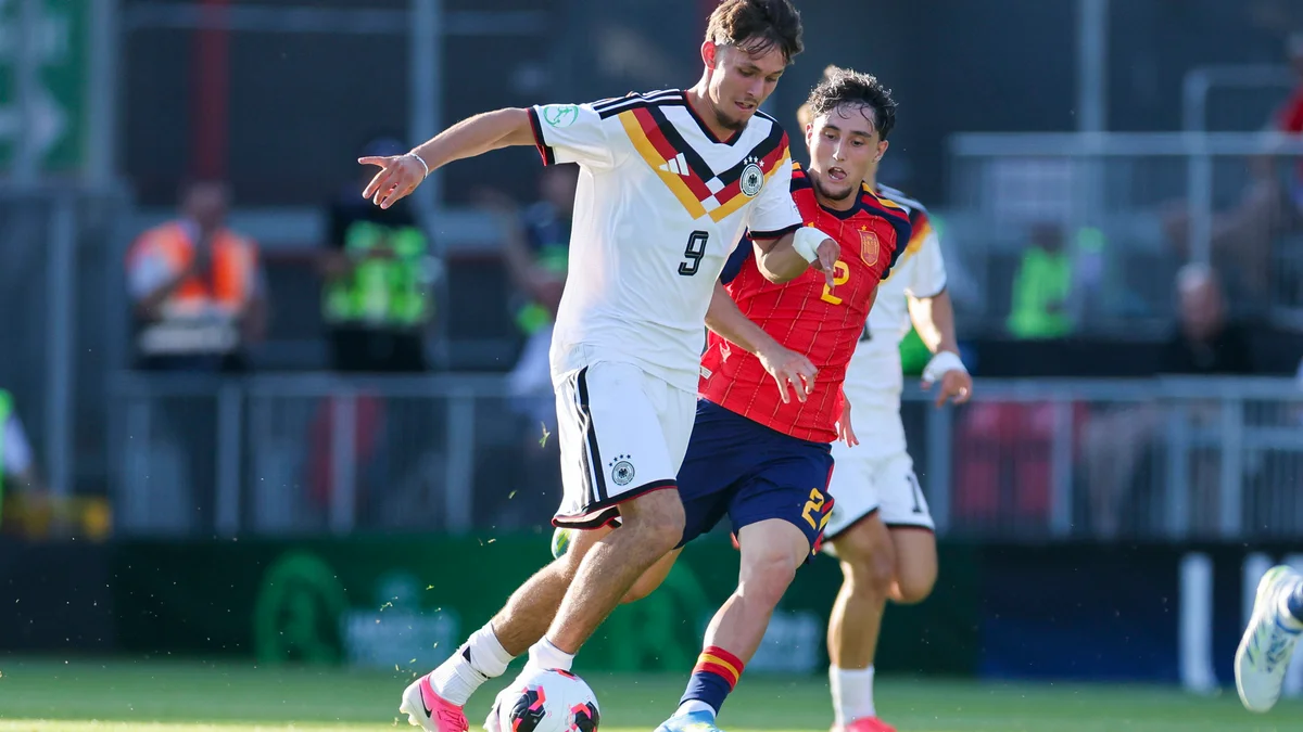 Spain's Jesus Fortea and Germany's Otto Stange battle for the ball during the UEFA U19 Championship final.