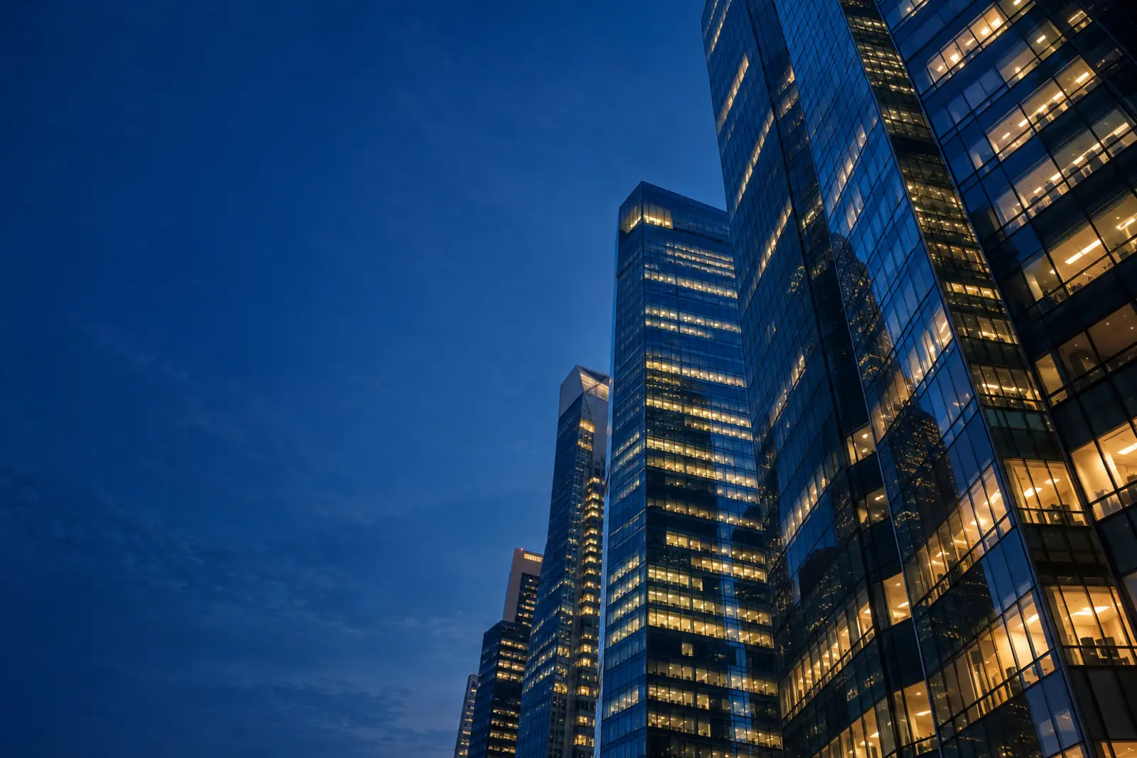 Office towers in Singapore's business district at dusk