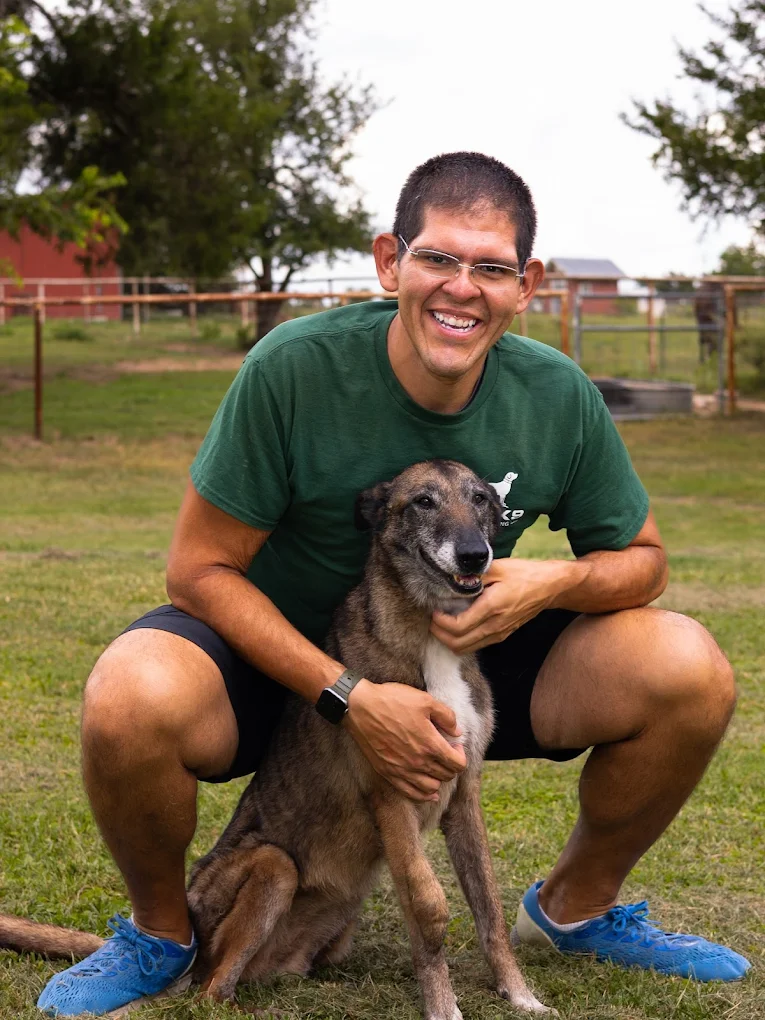 Steven, co-owner of ATX K9 Dog Training, with a dog