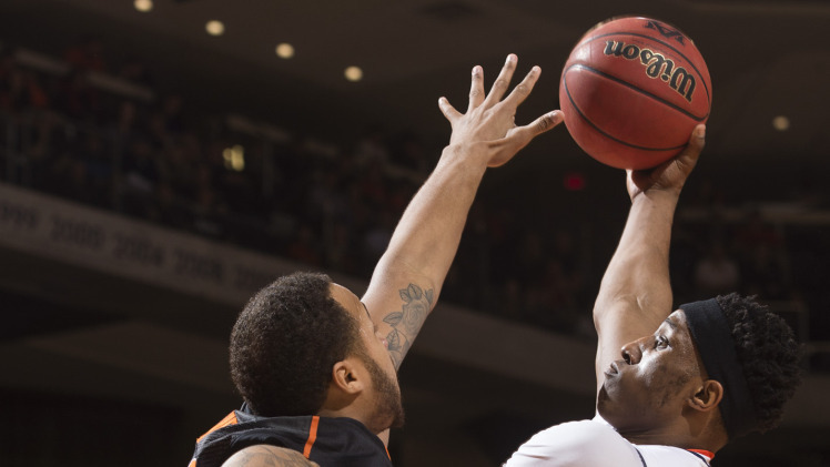 Auburn's Horace Spencer goes up strong against Oklahoma State