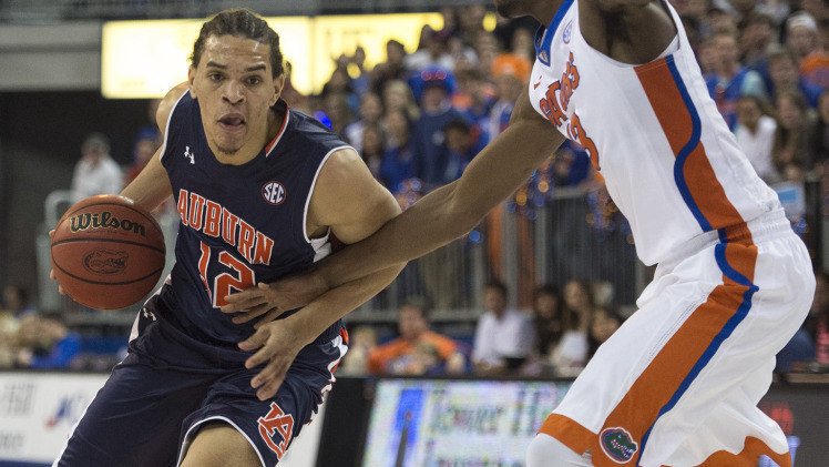Auburn's Tyler Harris is one the move for his team-high 14 points
