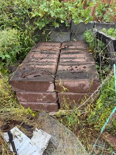 Stack of Large Brown Concrete Slabs - Image 1