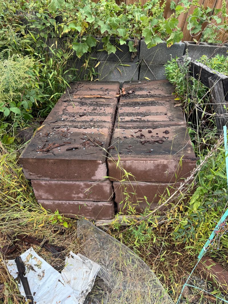 Stack of Large Brown Concrete Slabs - Image 1