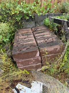 Stack of Large Brown Concrete Slabs - Image 2