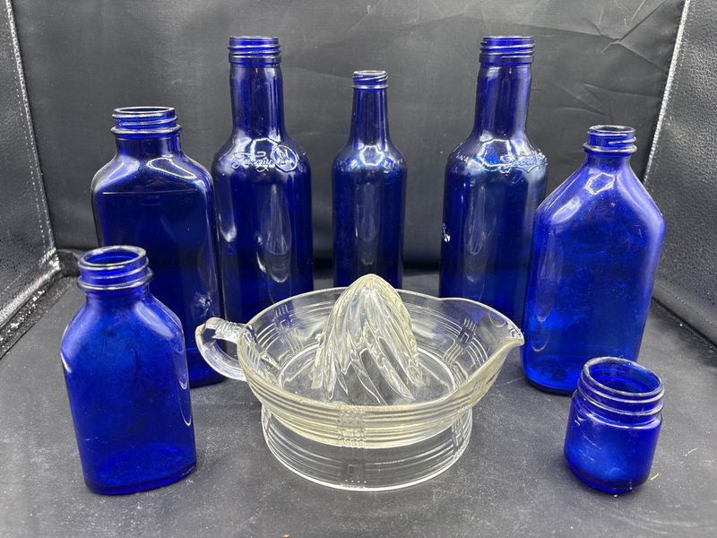 Cobalt Blue Glass Bottle Collection and Hazel-Atlas Criss-Cross Citrus Juicer - Image 1