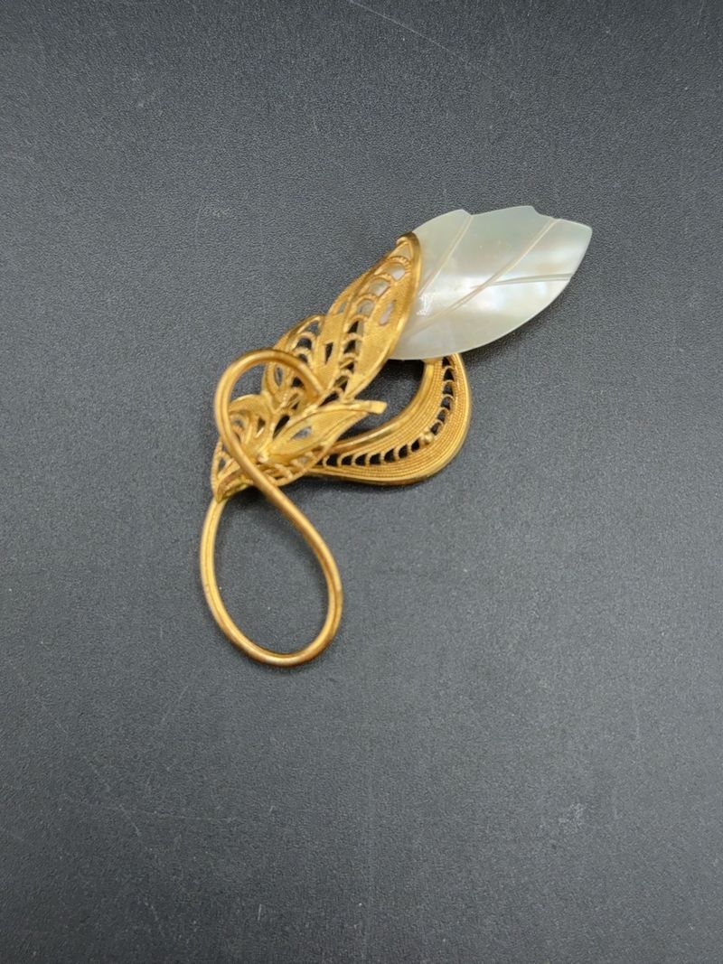 Gold Tone Filigree Foliage Brooch With Carved Mother of Pearl Leaf - Image 1
