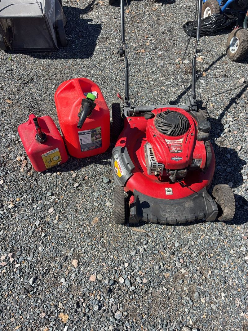 Walk-Behind Lawn Mower with Gas Cans - Image 1