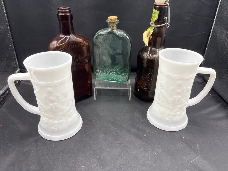 Group of Glassware Including Milk Glass Steins and Amber Bottles