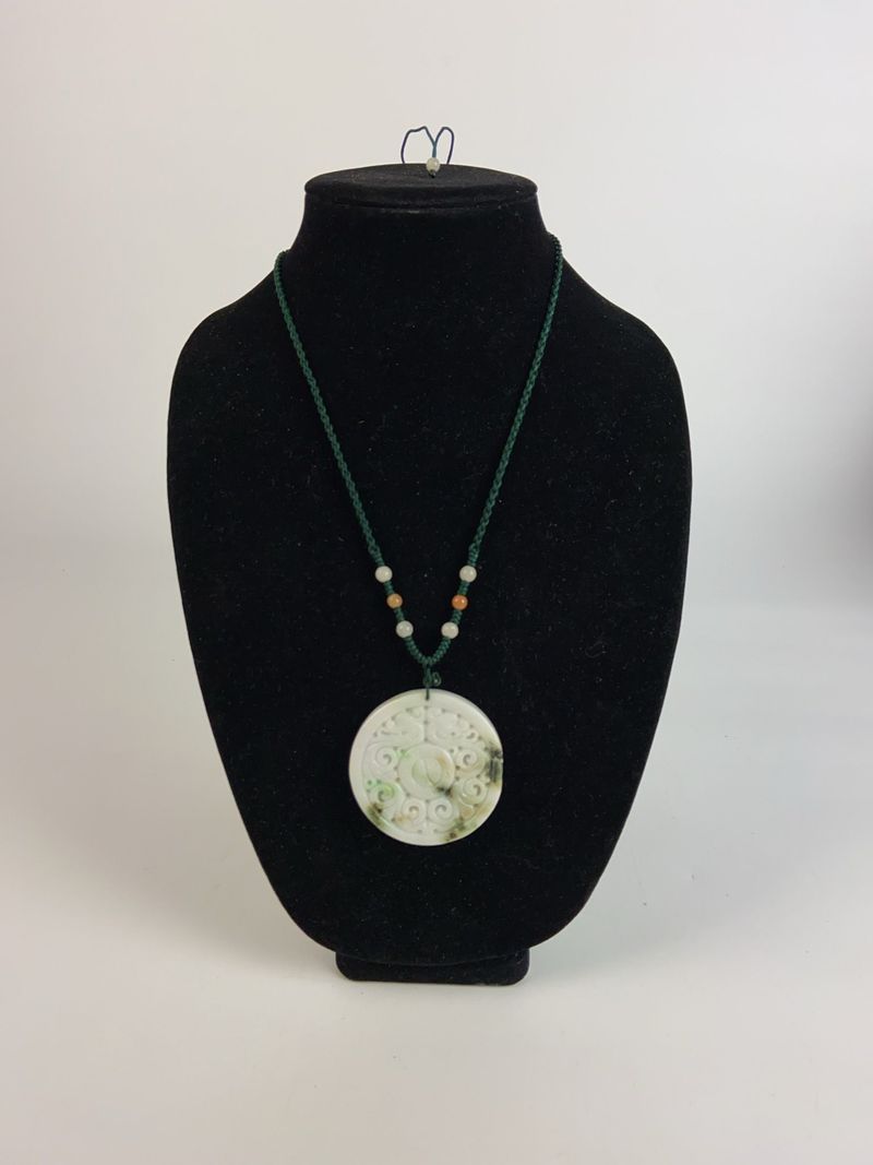Carved Jade Pendant Necklace with Green Cord - Image 1