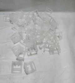 White Plastic Clip-On Fasteners - Image 1