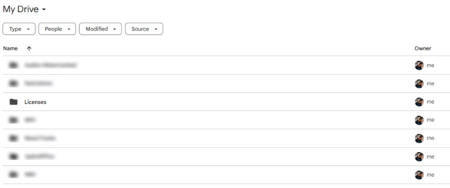 Google Drive view with several blurred project folders and a clearly labeled “Licenses” folder used to store music license documents and proof files.