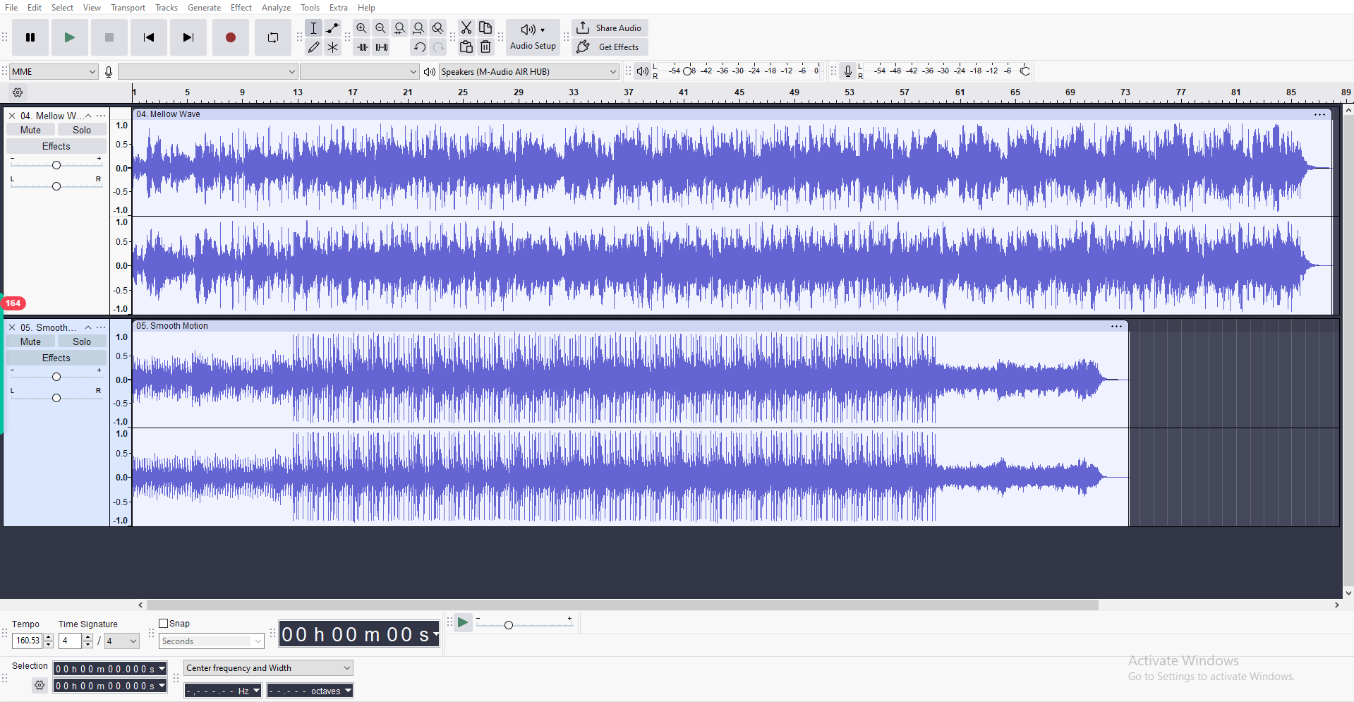 Audacity audio editor interface showing dual stereo waveforms and basic editing tools