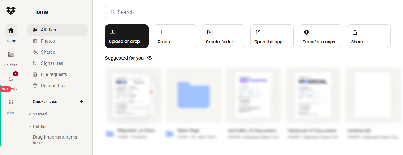 Dropbox web interface with file upload, folder creation, and real-time file sync options displayed.
