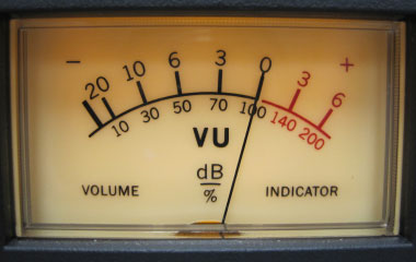 Analog VU meter displaying average signal level as part of input gain monitoring during audio recording