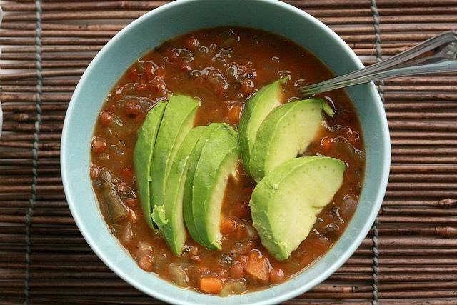 Lentil soup and avocado with crackers and cheese