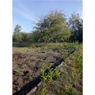 Dacha plot with unfinished construction