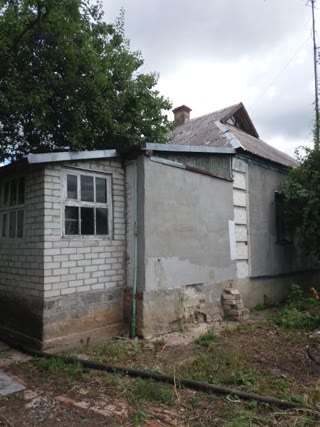 For Sale 1/2 of a House, s=42 m2 in the City of Pervomaisky, Koptsova St. 29, Apt. 1