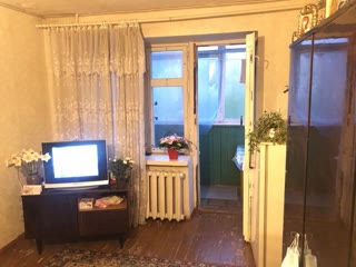 For sale two-room apartment in living condition in the center of the village of Budy