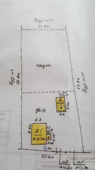 Old house with a plot for construction