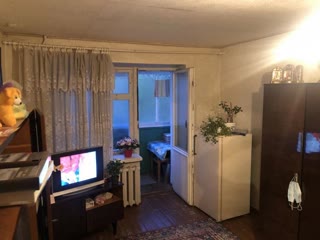 For sale two-room apartment in living condition in the center of the village of Budy