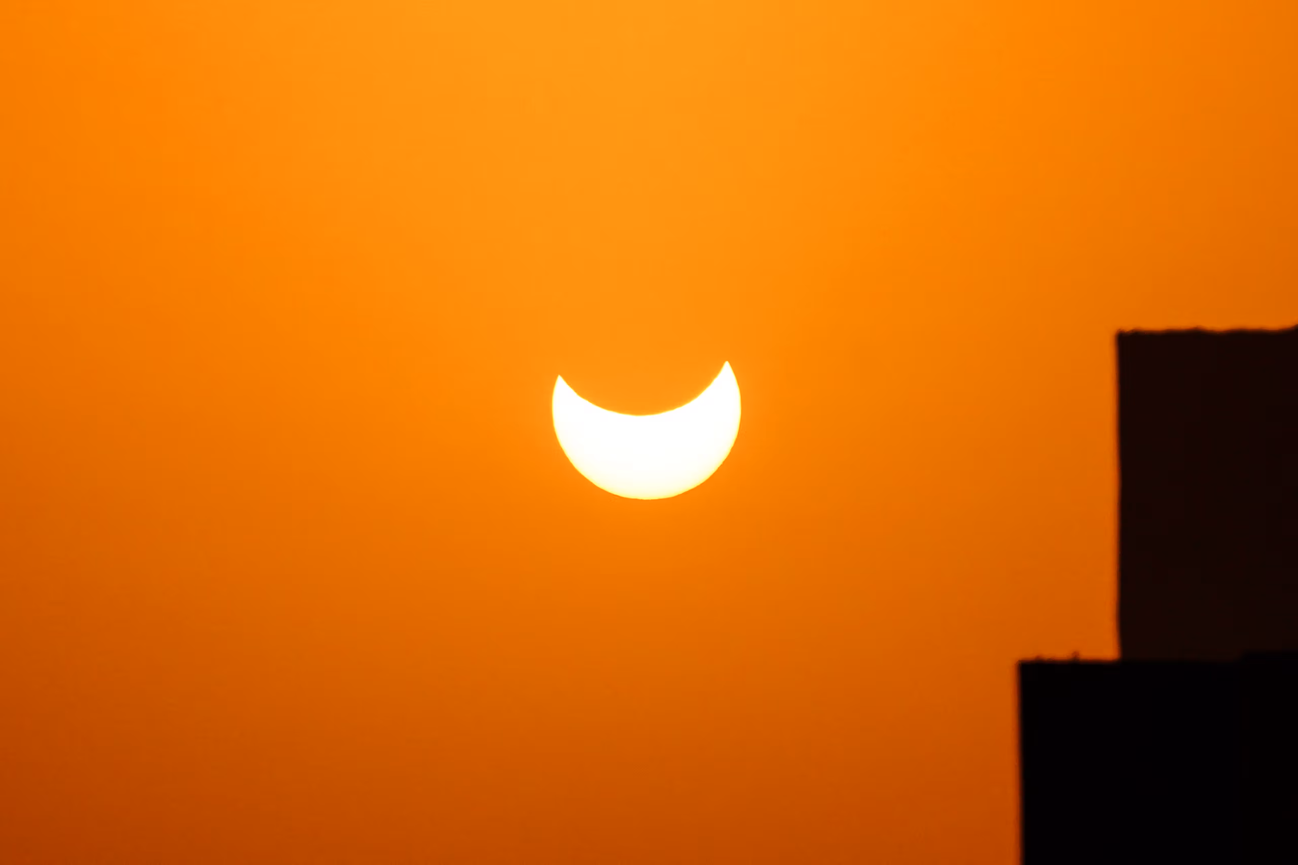 The Cosmos on a Schedule: Africa Pauses for a Partial Eclipse