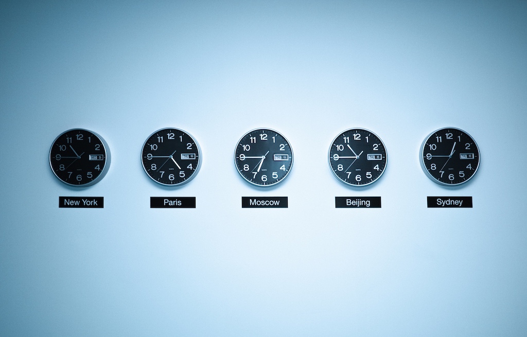 Clocks on wall for working across time zones in a distributed team