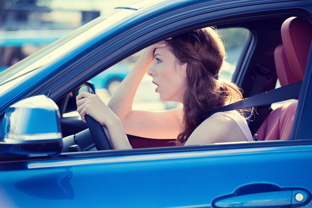 Woman stressed in car on the office commute