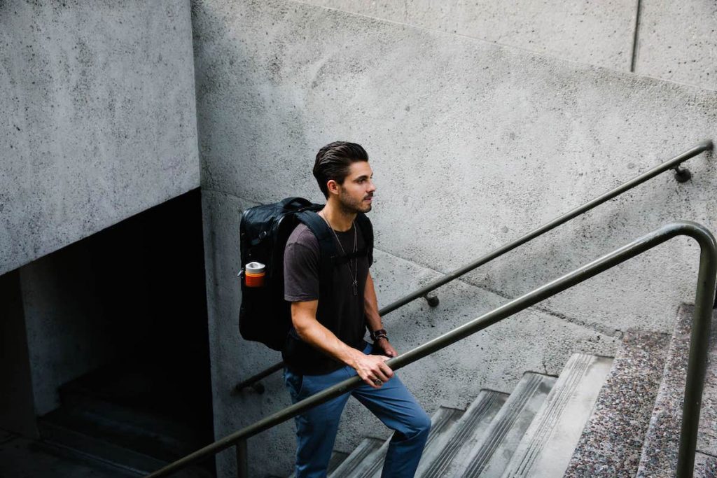 Man travelling Anywhere with a Tortuga Backpack