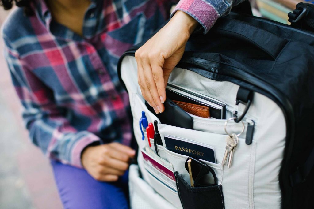 Traveller arranging their items in a Tortuga backback