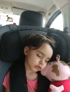Elisa in her Axkid car seat