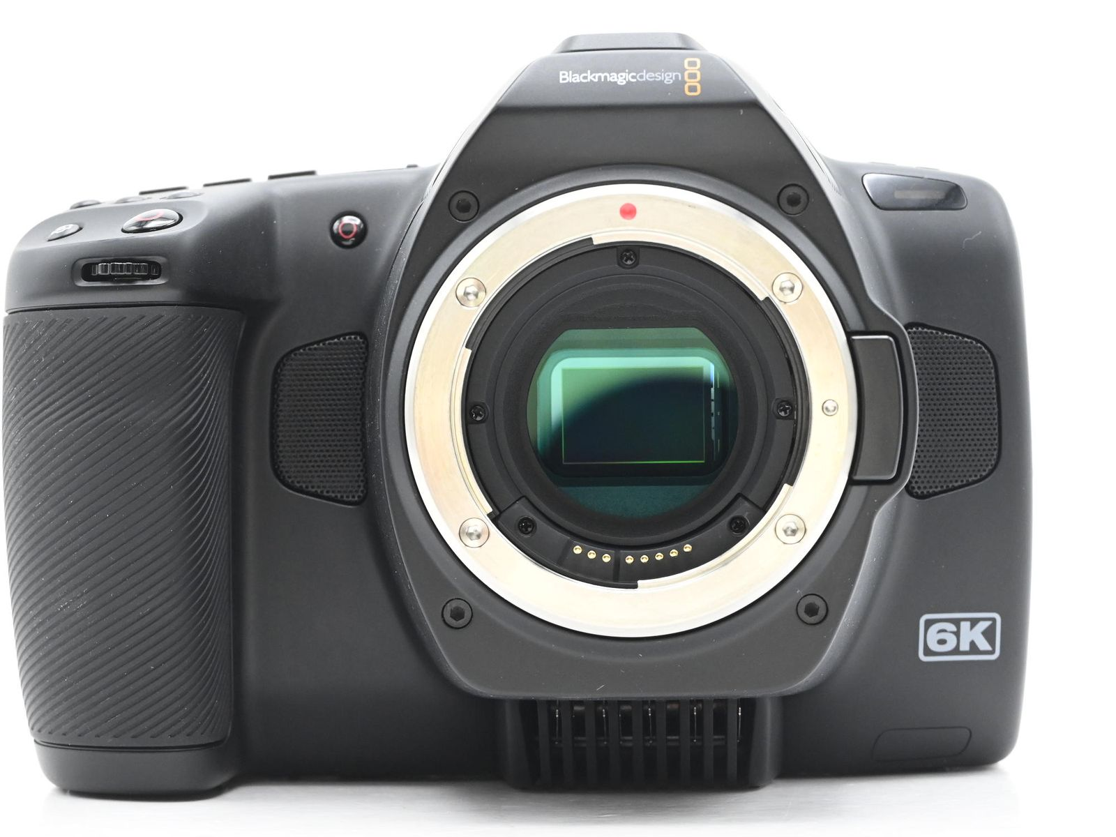 Blackmagic Pocket Cinema Camera 6K body with Canon EF mount, battery pack, and Promaster Traveler Flex charger — compact filmmaking for social media creators