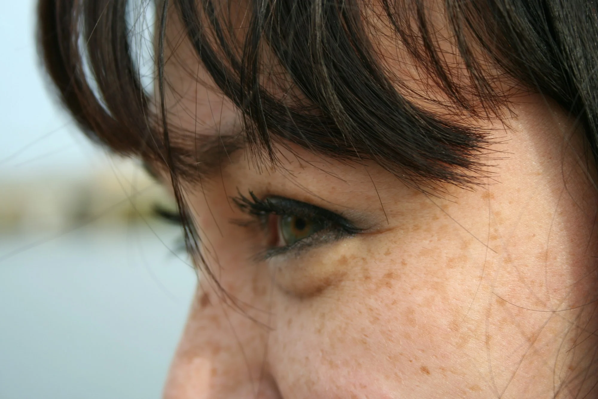 An editorial close-up of an individual face — beauty as deeply personal