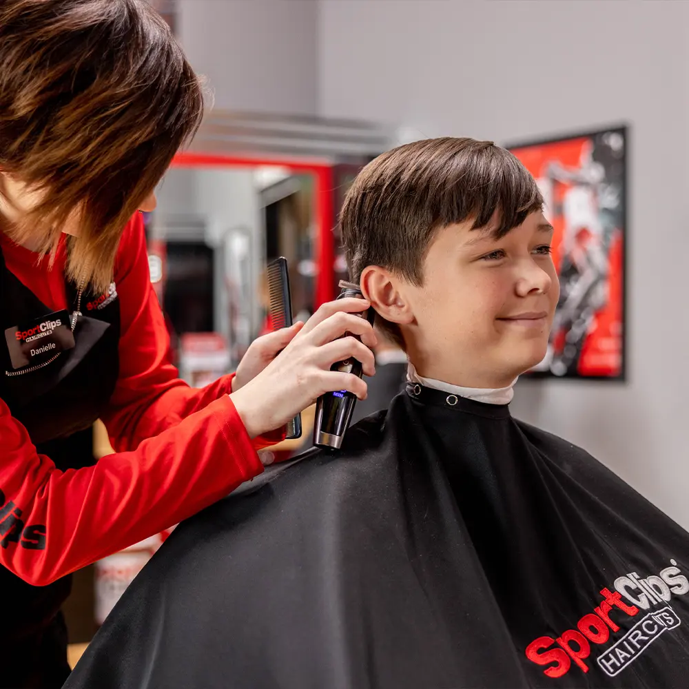 Young boy getting a haircut