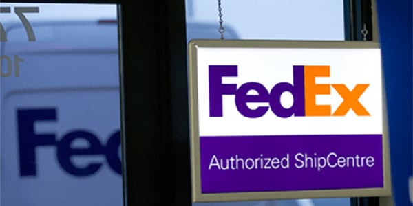 FedEx Authorized ShipCentre logo