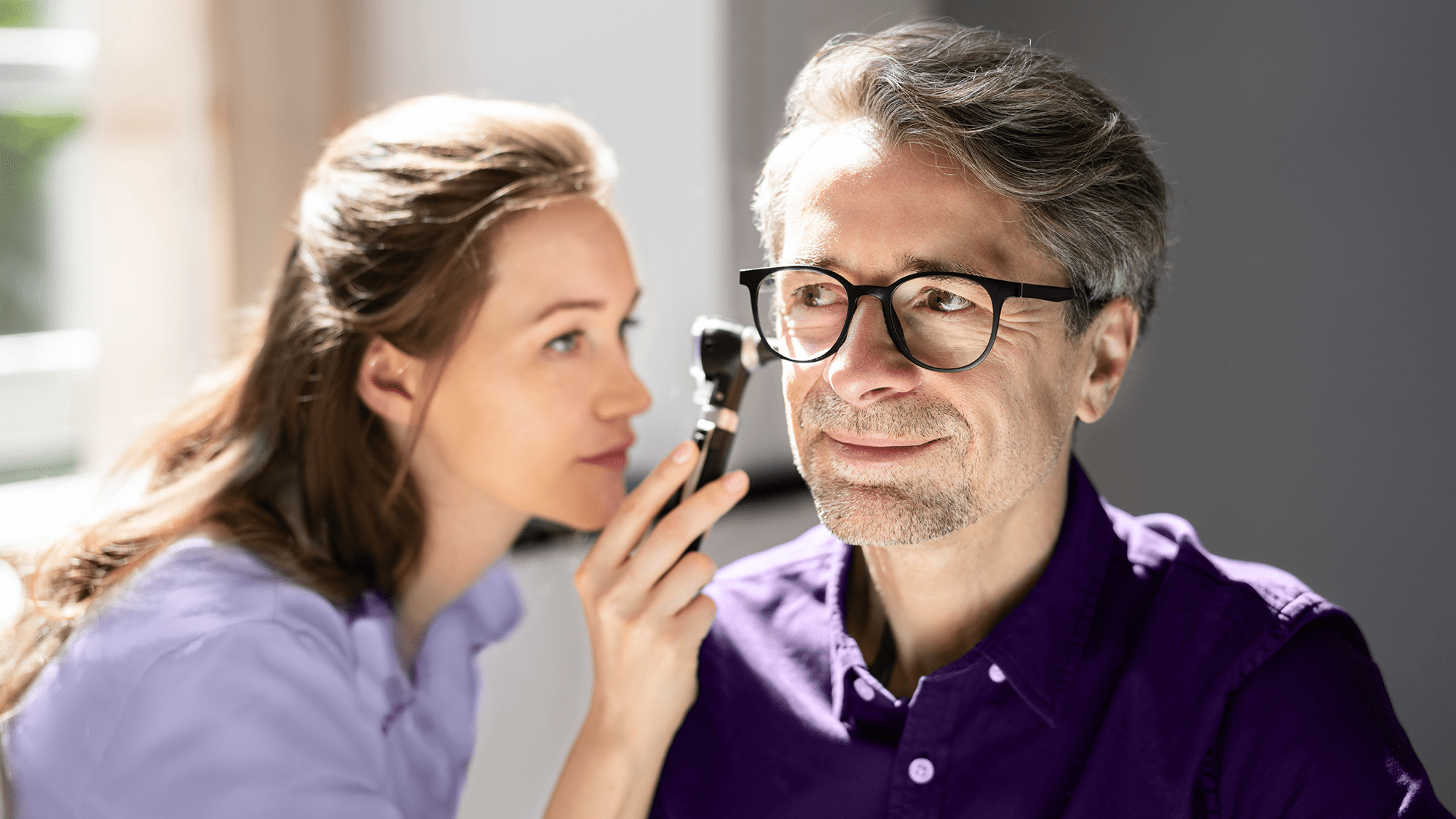 Audiologist Checking Hearing Loss