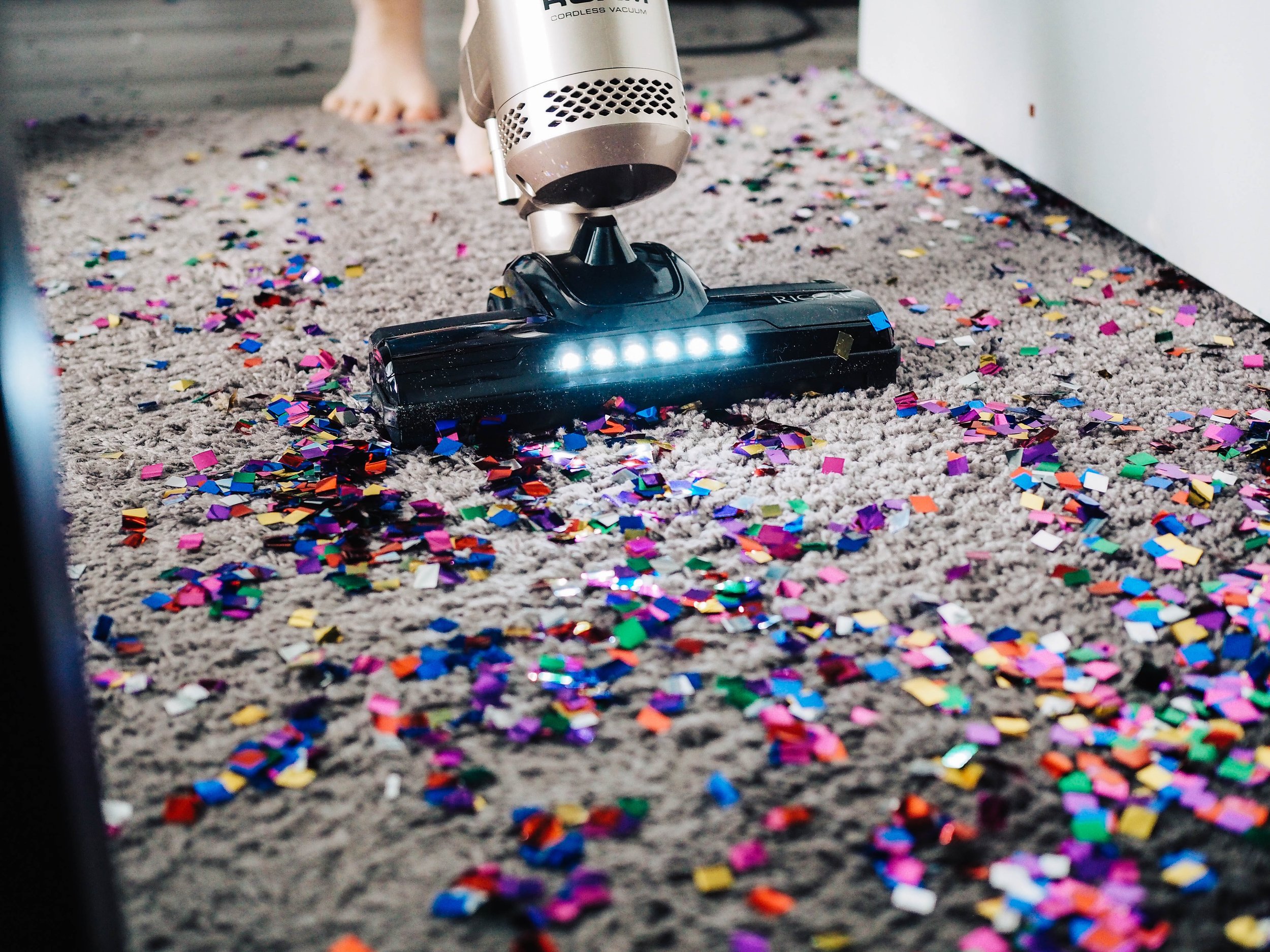 Vacuuming confetti on carpet