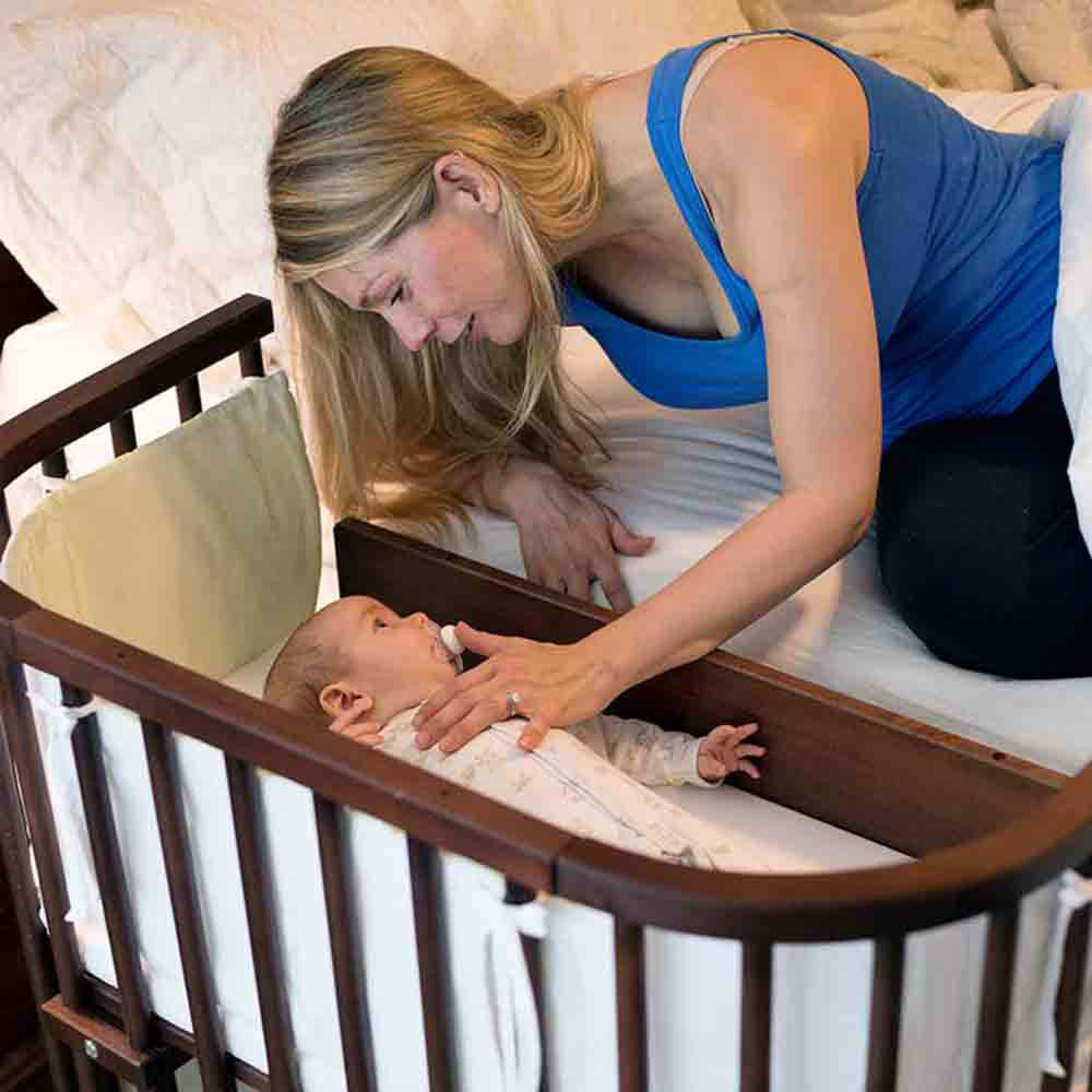 baby cot attached with bed