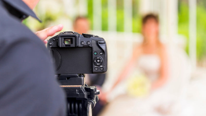 Wedding photographer capturing a photo of the bride and groom for his wedding photography Youtube ch
