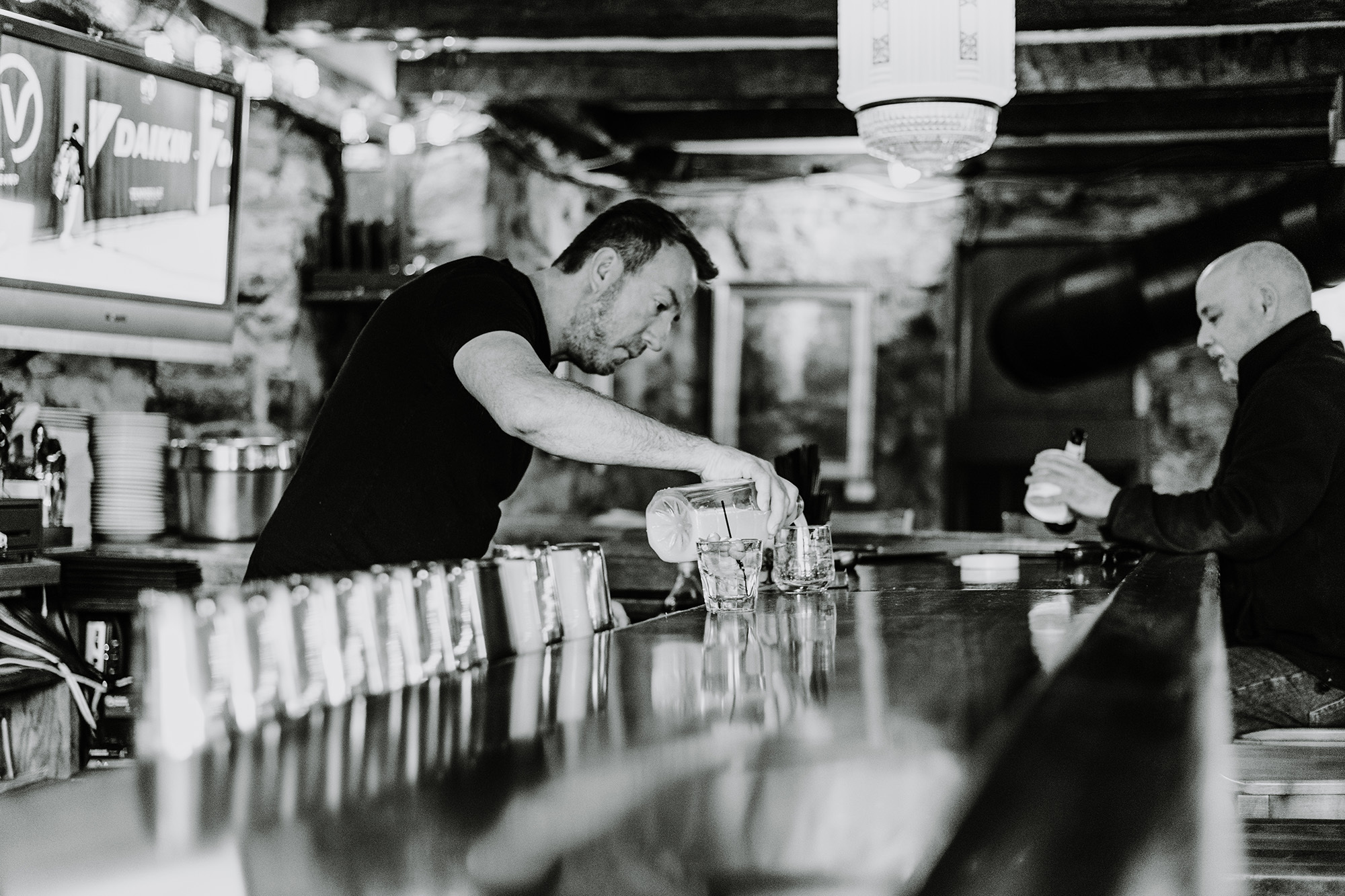 Bartender Tony pouring a drink