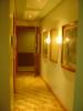 hallway with nice picture frames.