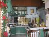 Kitchen as seen from Dining Area, with Dirty Kitchen & Grill Area outside