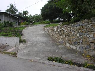 Wide Re-enforced Driveway and Marble stone Wall of Oceanfront property