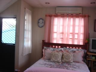 master's bedroom with door leading to veranda