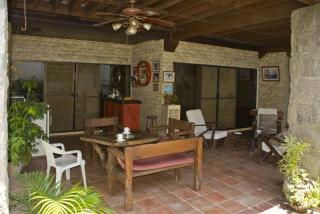 Large covered patio with bar