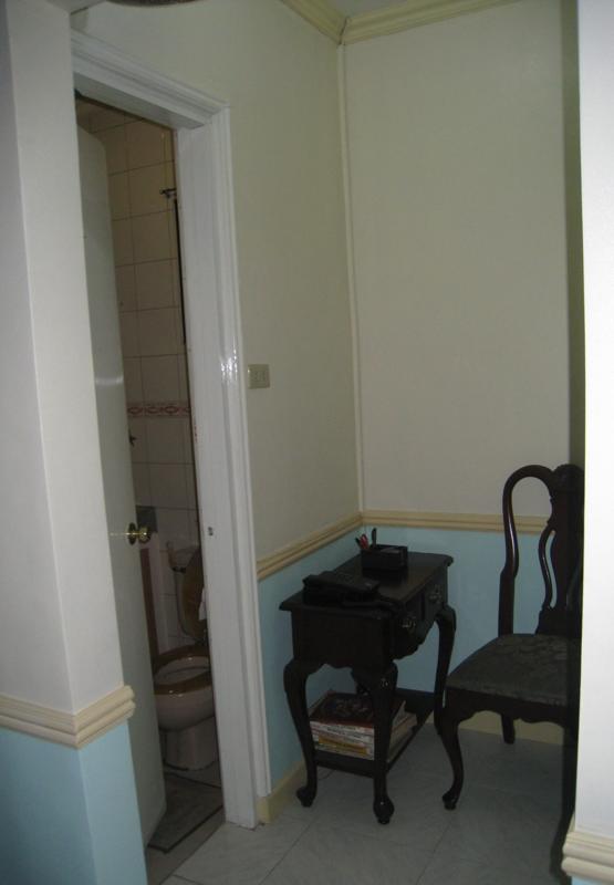 phone table leading to powder room