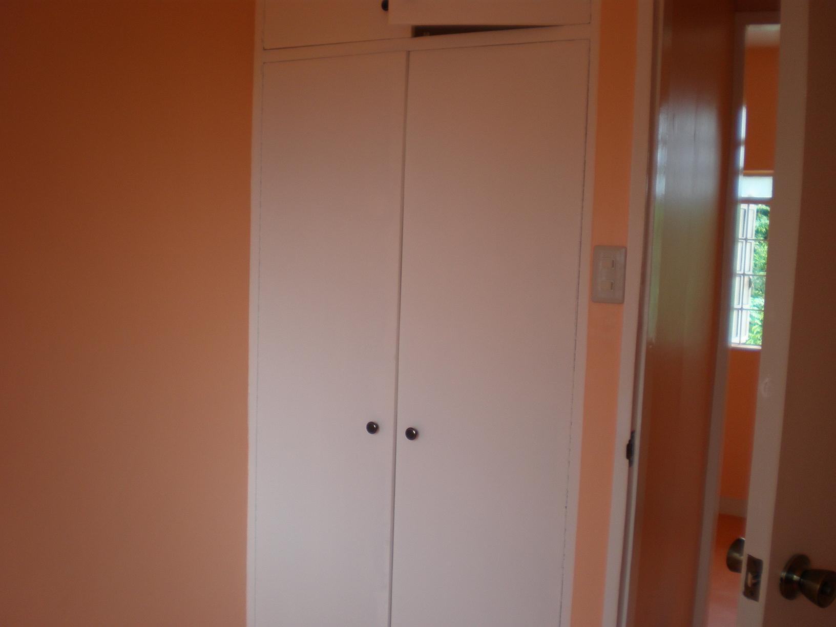 bedroom 1 w/ built in cupboard