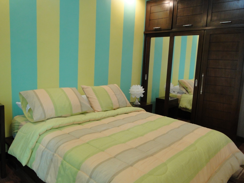 the bedroom with mahogany cabinets